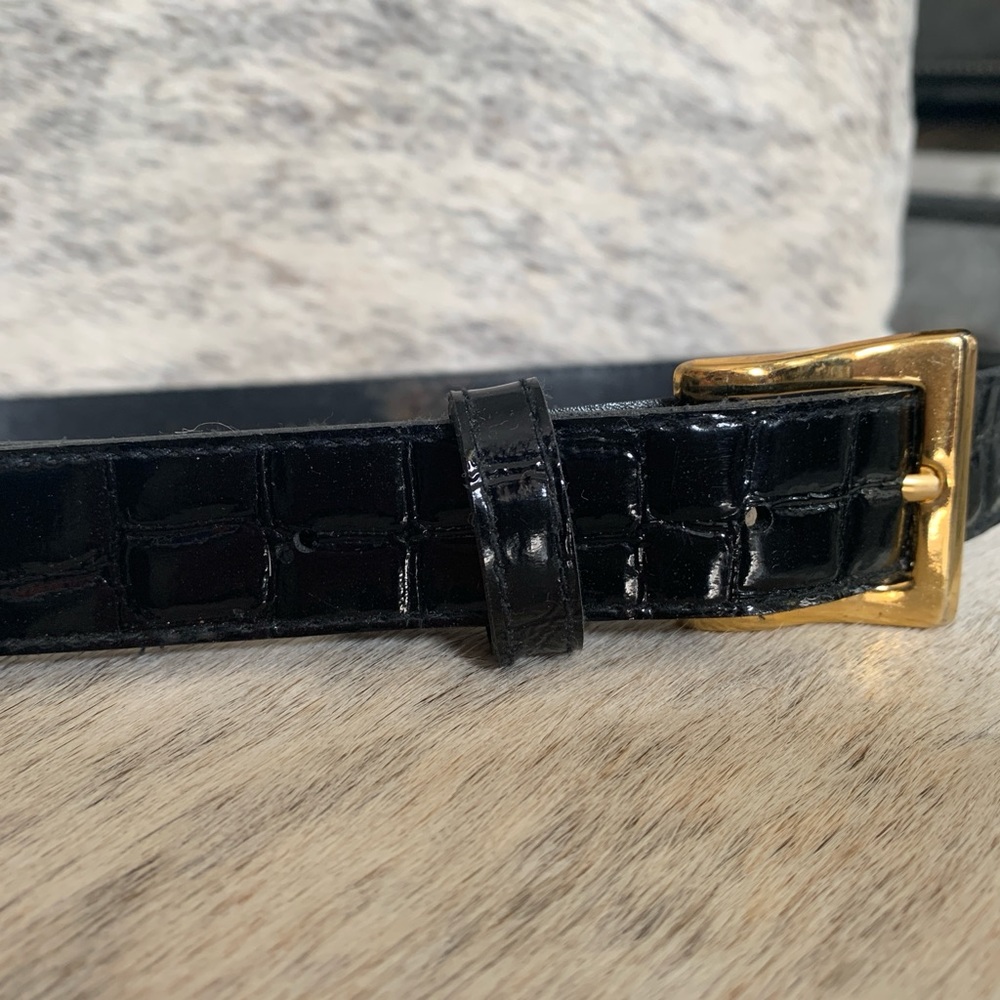 Black patent, croc effect belt. Brass colored buckle, 36” long.